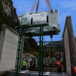 craning of kolektor etra oil-filled electric transformer on electrical substation site