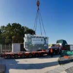 craning of kolektor etra oil-filled electric transformer at hydroelectric power station site