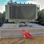Outdoor installation of an electrical transformer on an ERT® -W bund, fire-retardant, hot-dip galvanised steel, beams adjustable in width.