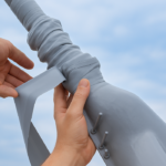 Installation of a self-fusing silicone insulating tape for bird protection.