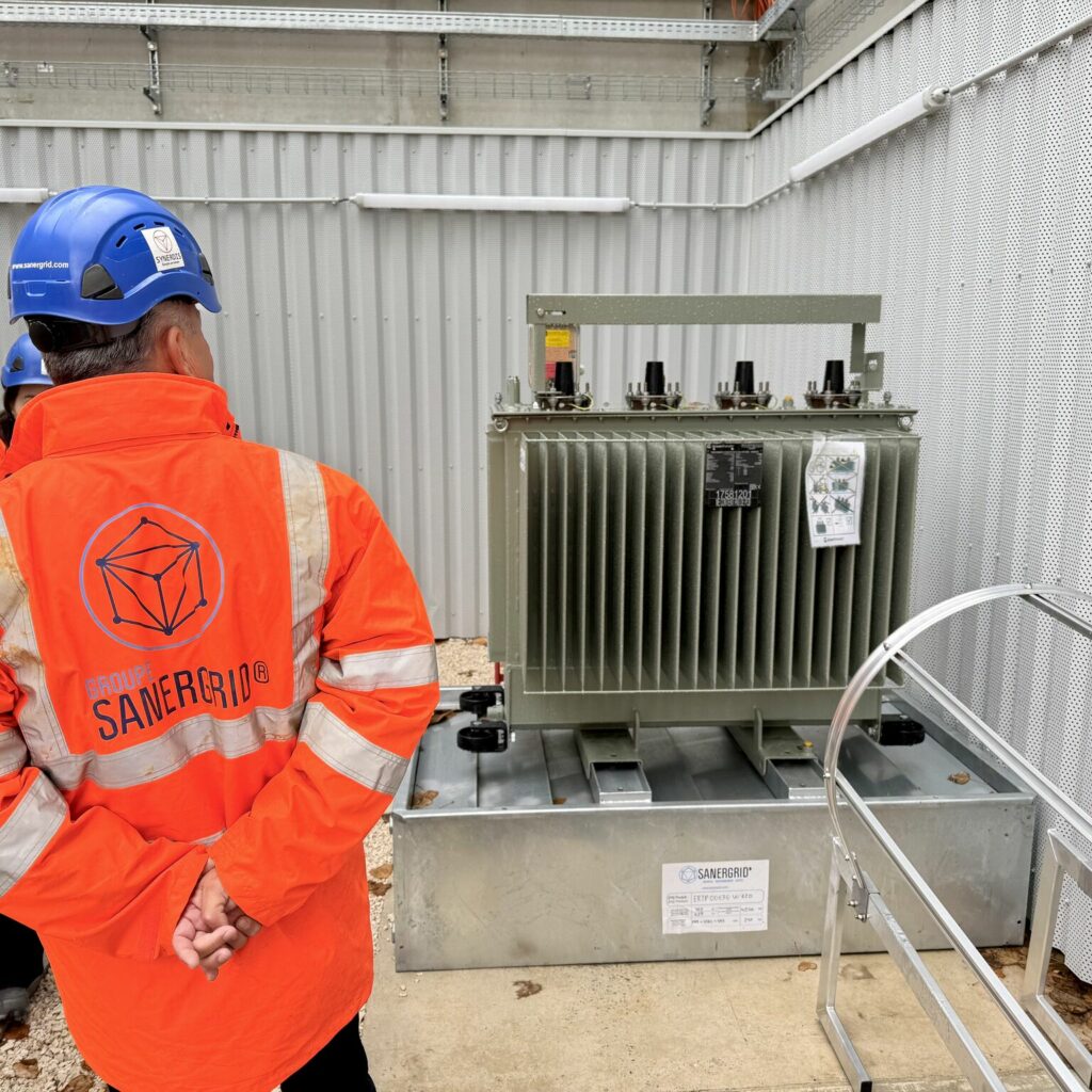 ERT SANERGRID containment basin with fire barrier shutter under oil-filled transformer with fixed beam